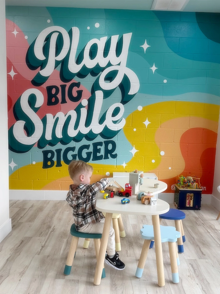 playful pediatric dentistry little boy playing in the lobby